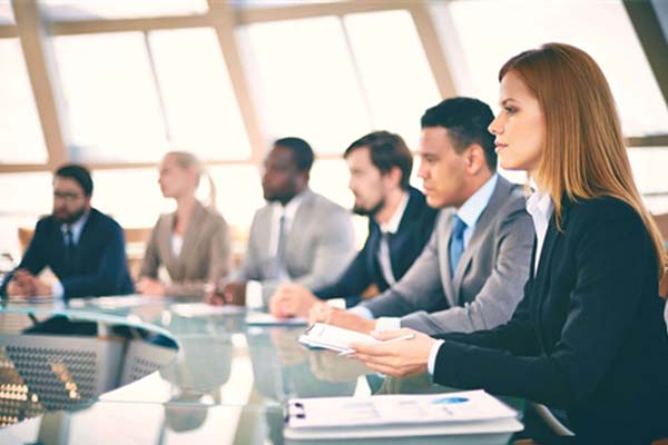 Business students sitting in a boardroom