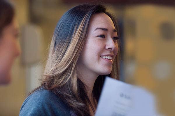 A woman smiling