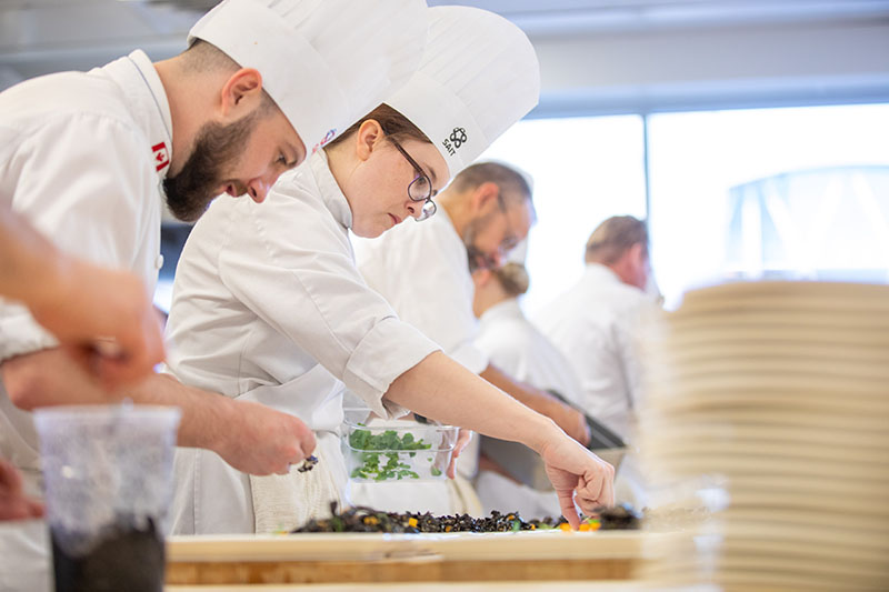 A group of Culinary Arts students doing food preparation.