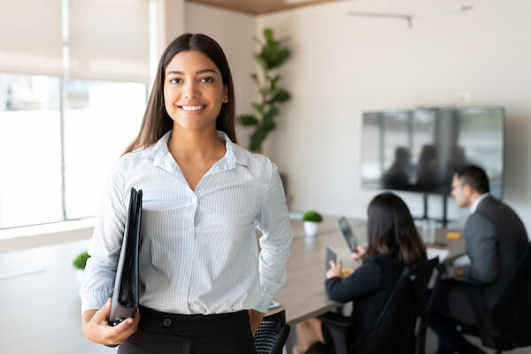 A woman holding some folders