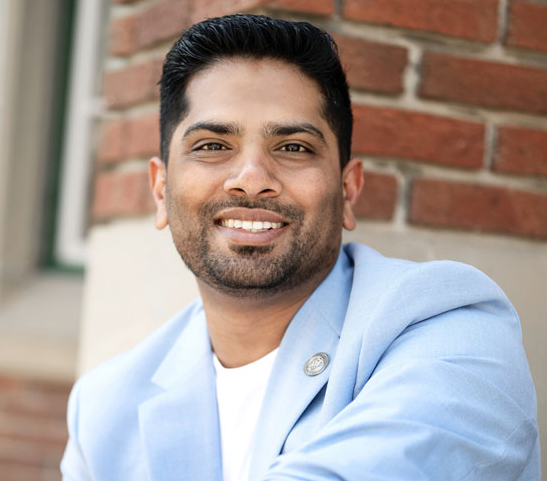 A headshot of Sanoop Sadique outdoors on SAIT campus.